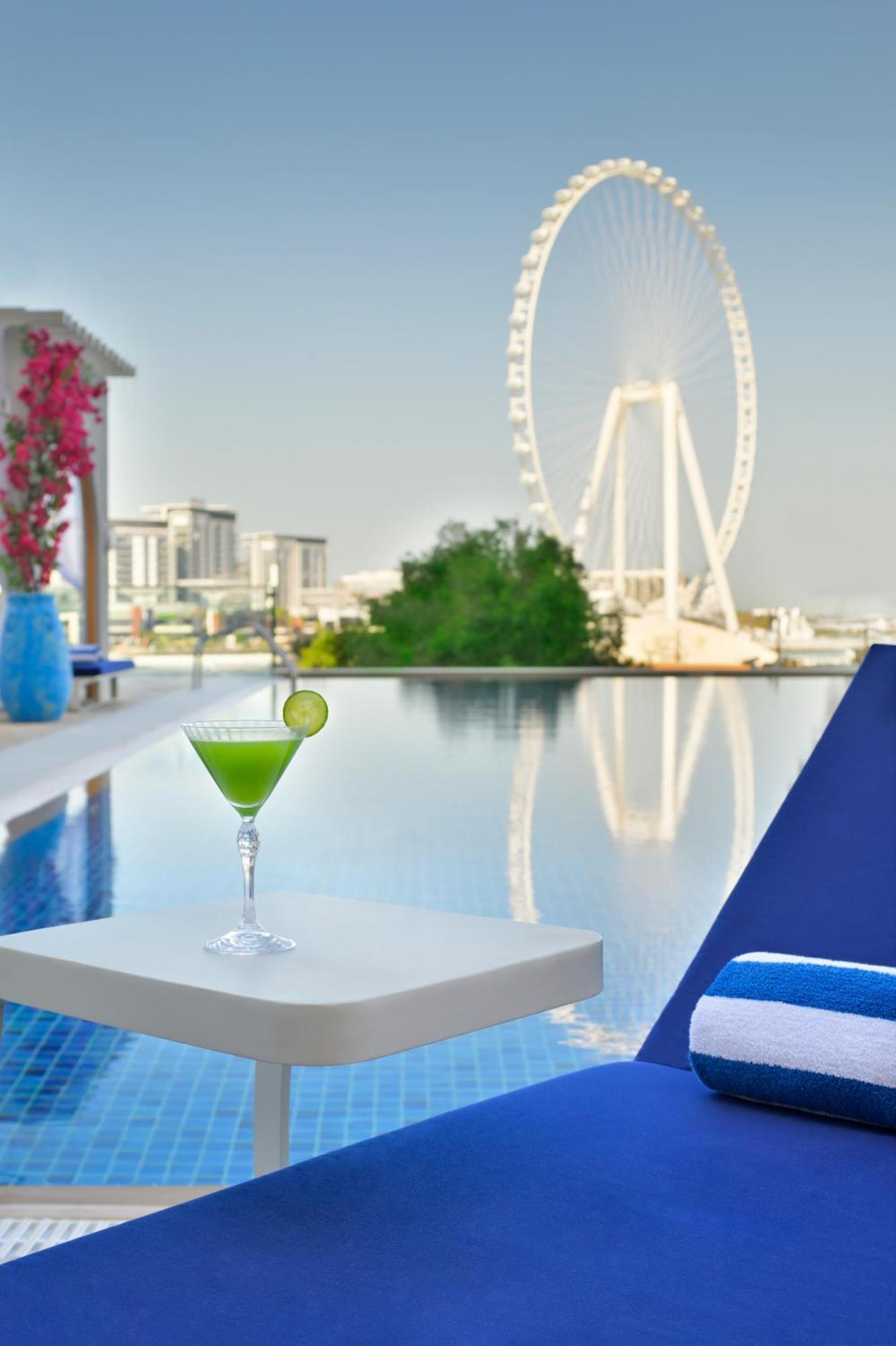 Ja Ocean View Hotel, Jumeirah Beach Dubai Esterno foto View of the Dubai Marina from the pool